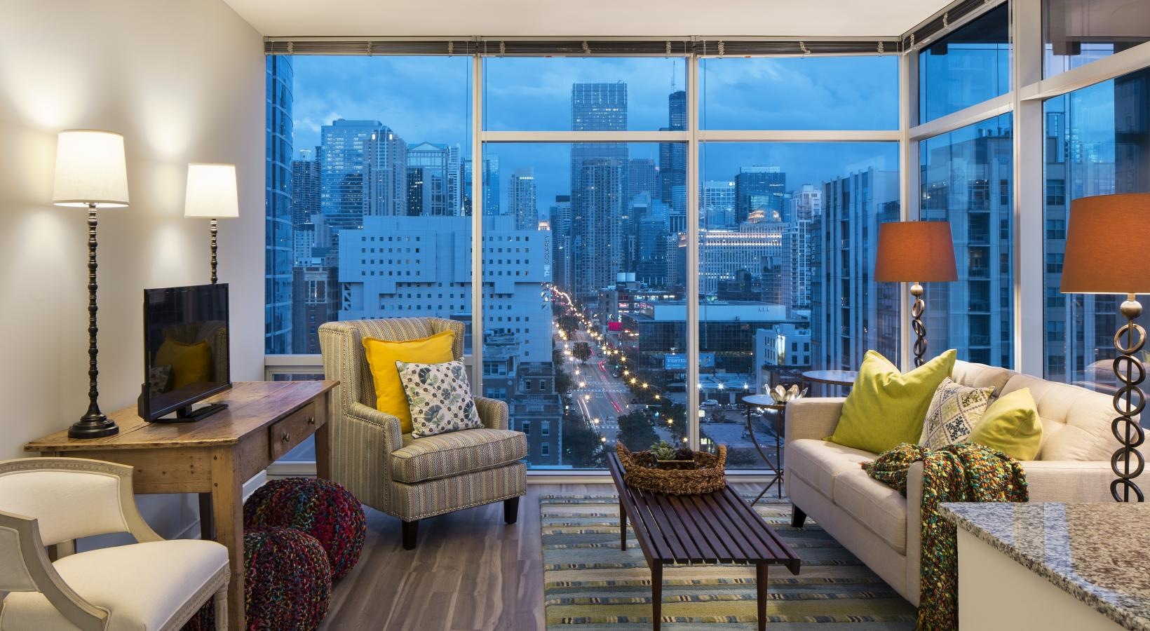 Relax and unwind in stylish living spaces a living room with a view of the city