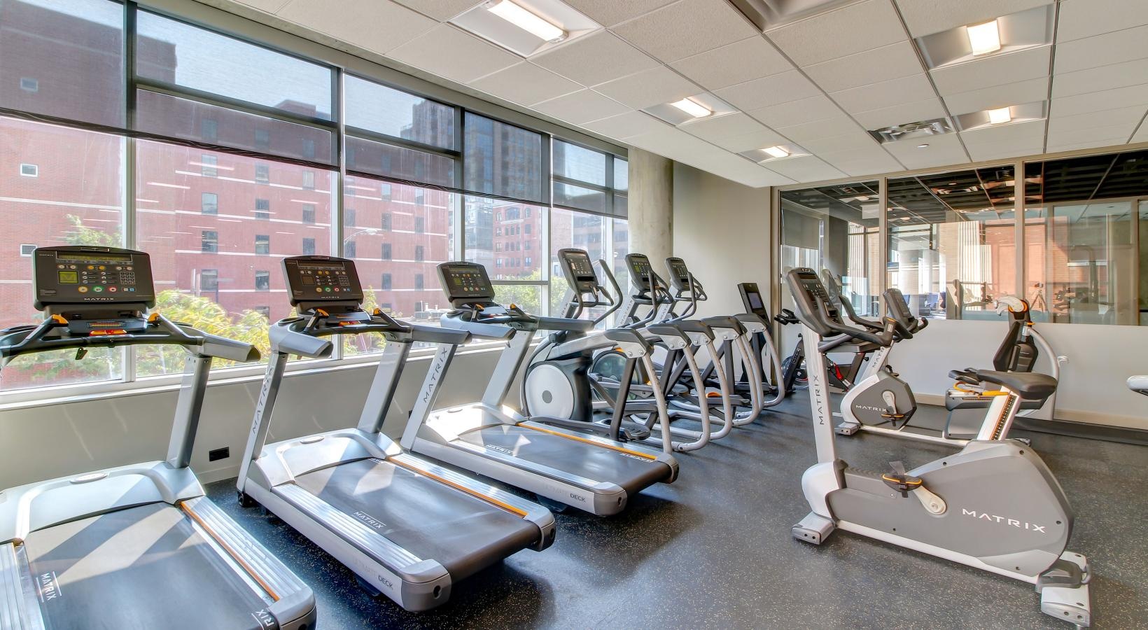 State-of-the-art amenities a gym with treadmills