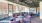 a room with purple chairs and a large window