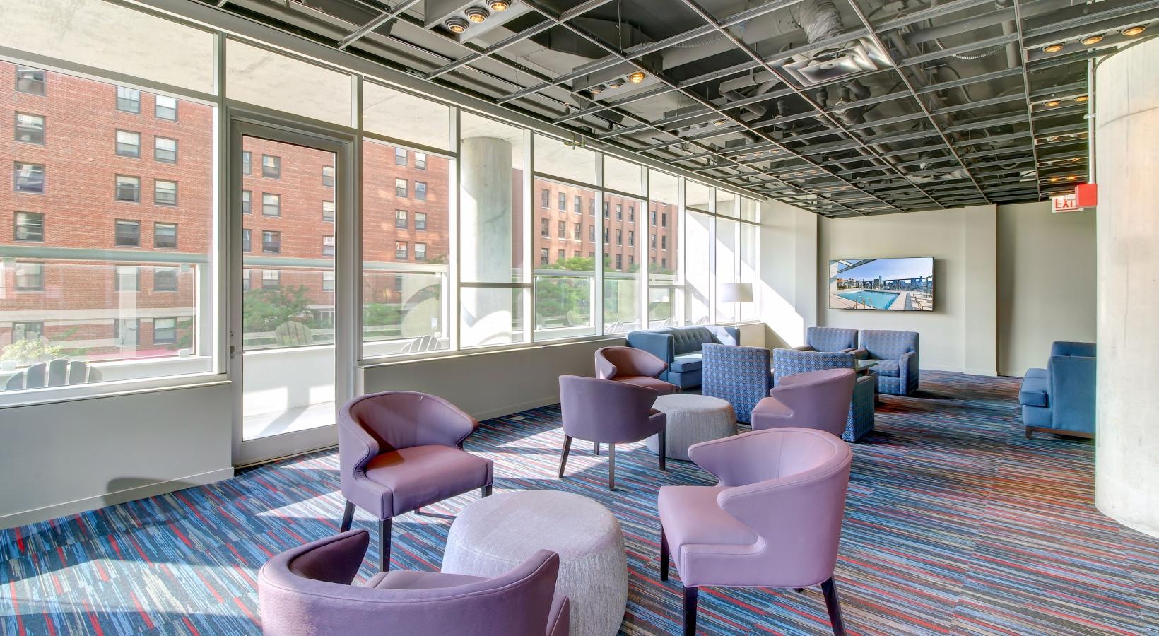 The essence of exceptional living a room with purple chairs and a large window