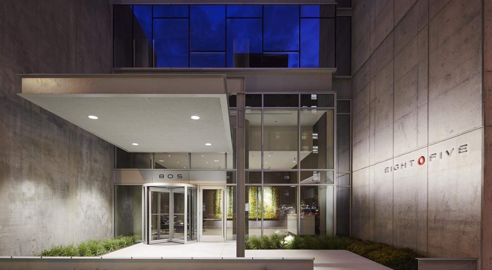 Settle into comfort at Eight O Five a building with glass windows