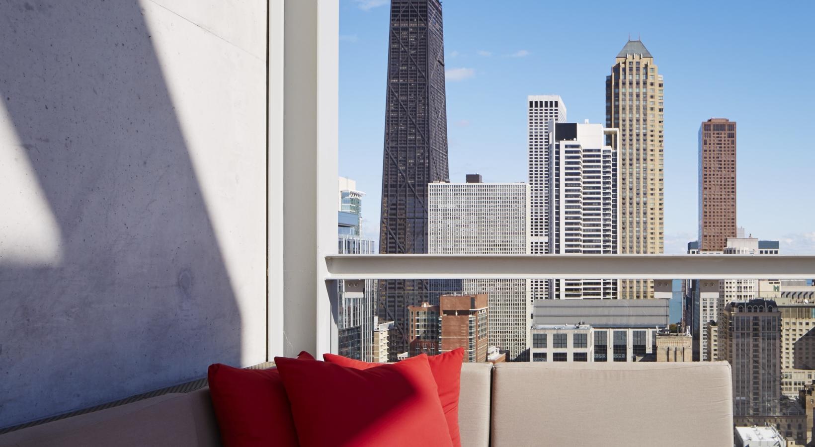 Find your perfect fit at Eight O Five a couch and a window overlooking a city