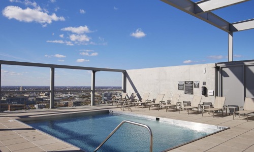 a swimming pool with a bridge in the background