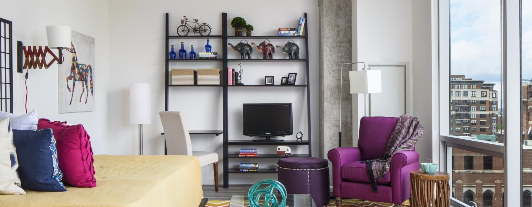 a living room with a tv and couches