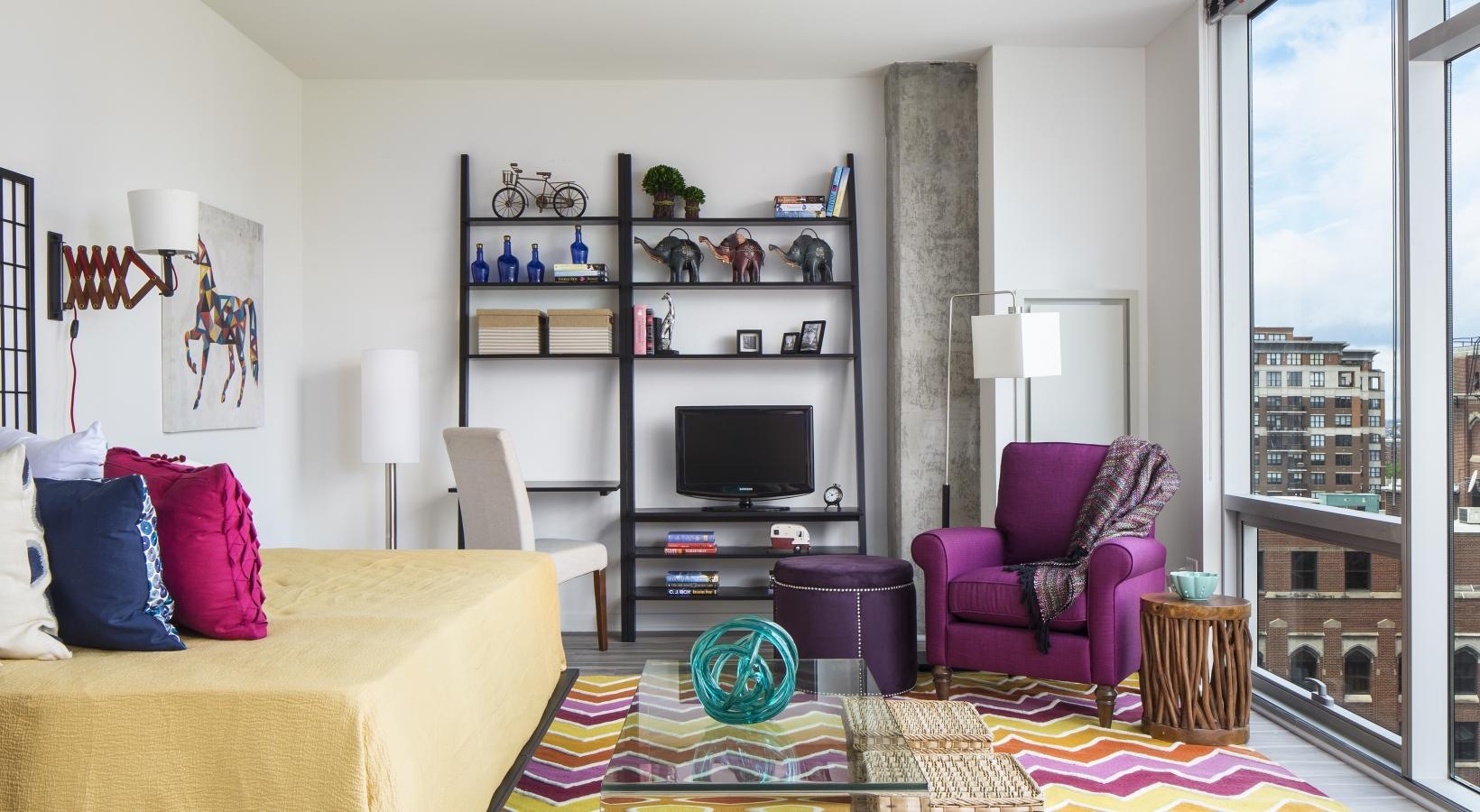 Wide open living areas perfect for entertaining a living room with a tv and couches