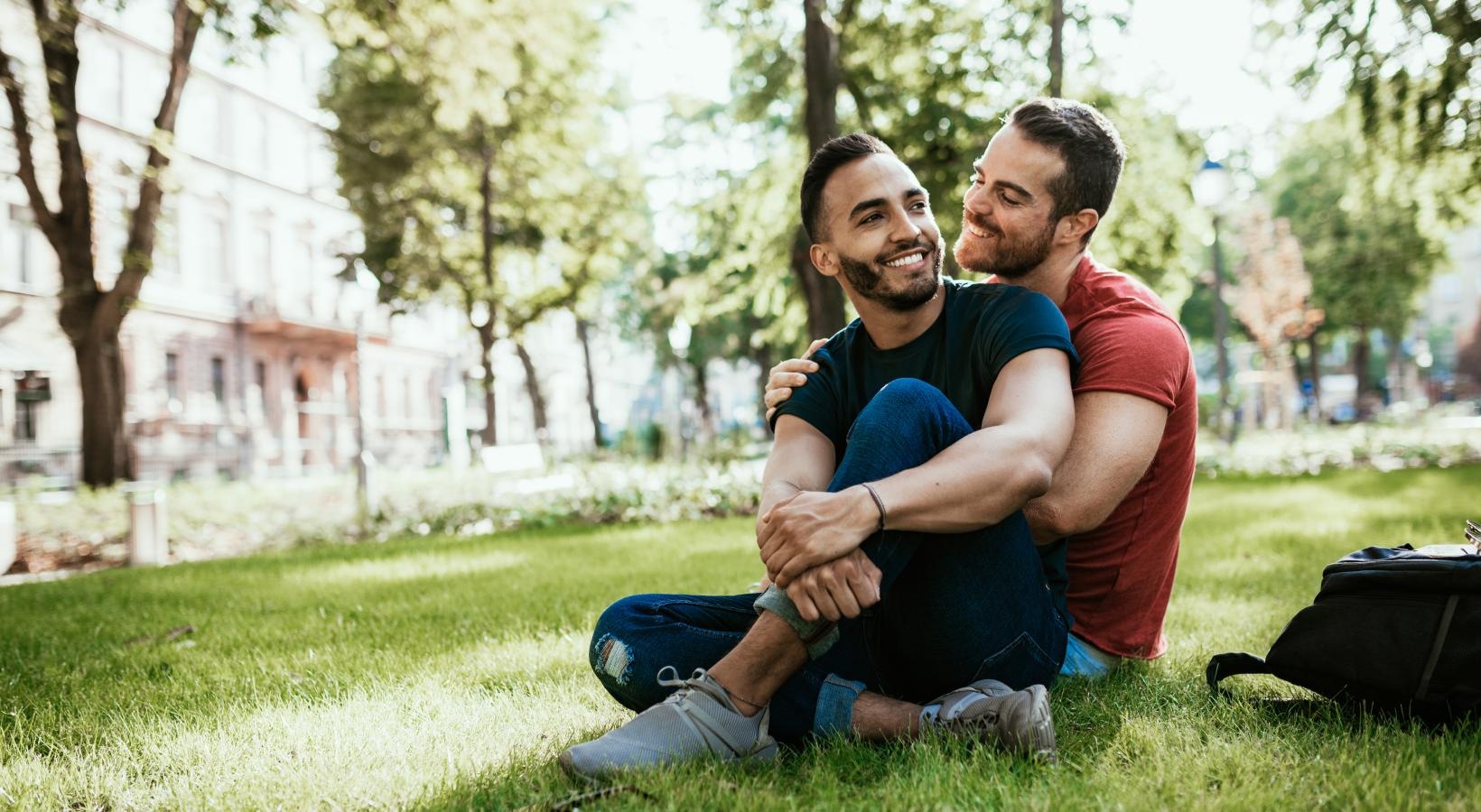 The essence of exceptional living a man and woman sitting on grass
