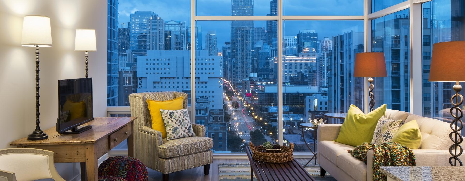 a living room with a view of the city