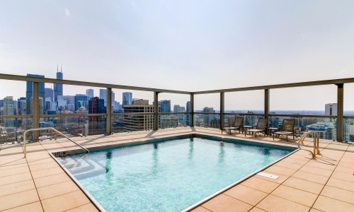 a pool with a city in the background