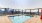 a pool with a city in the background