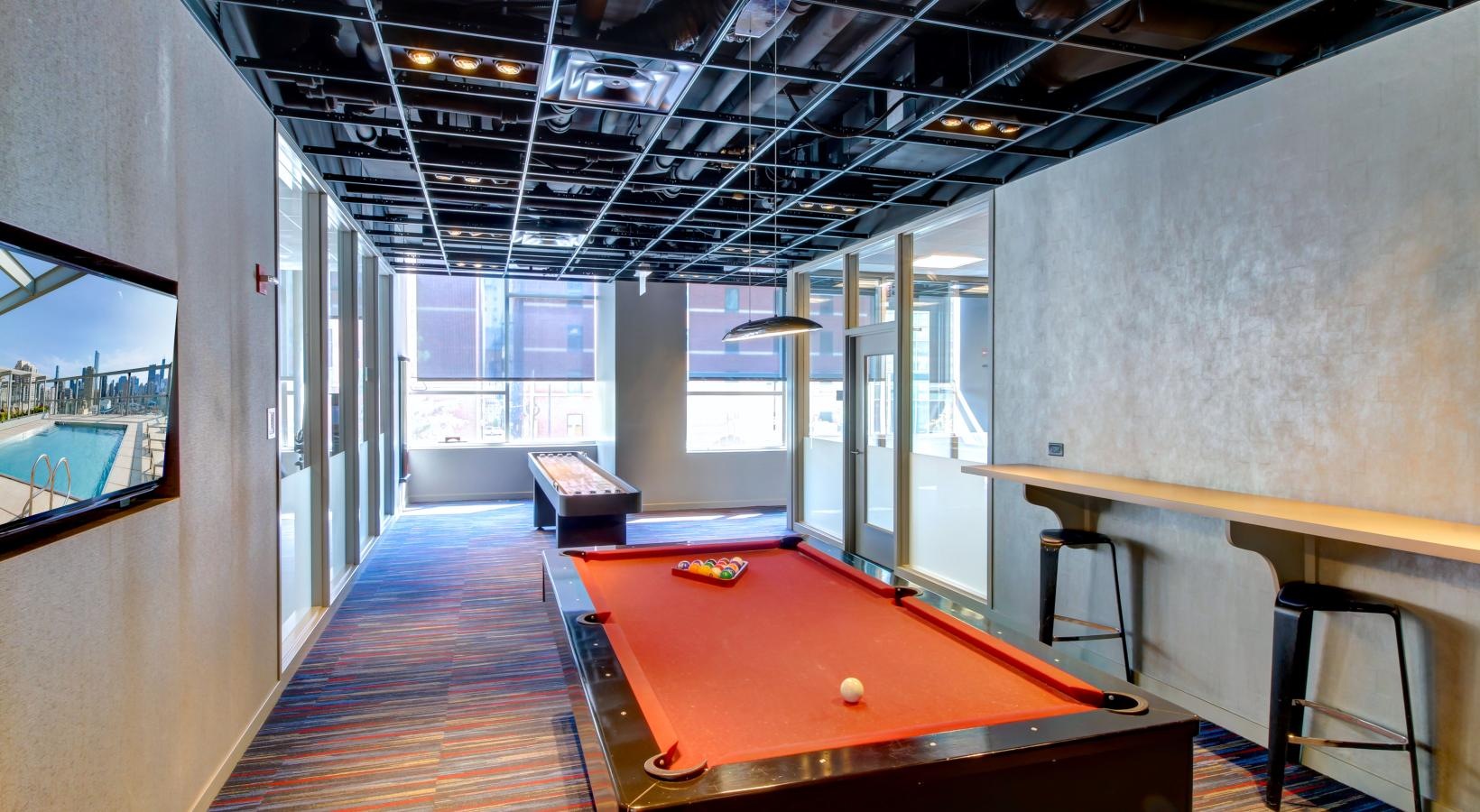 Access to resident-only features a pool table in a room